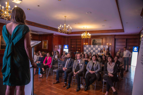 A woman making a presentation at a hotel venue