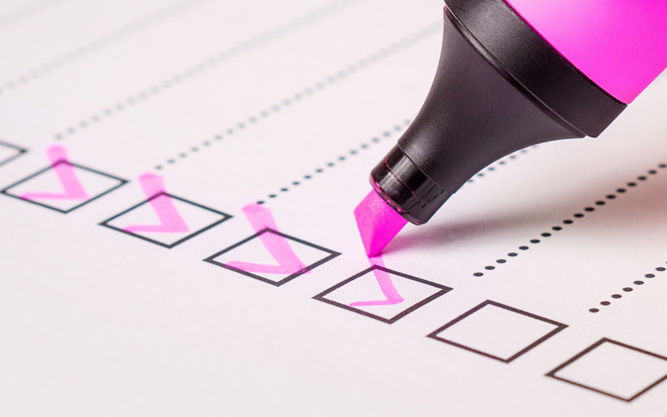 a check list for documents with a pink highlighter 