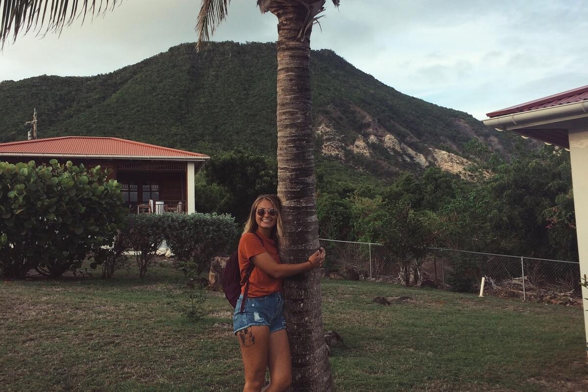 Student hugging tree