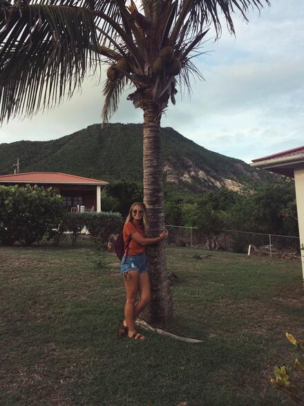 Student hugging tree